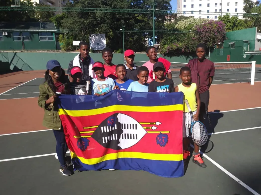Young players holding the flag of Eswatini